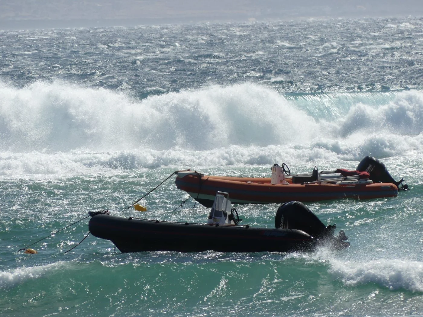 Two patrol RIBs in heavy surf